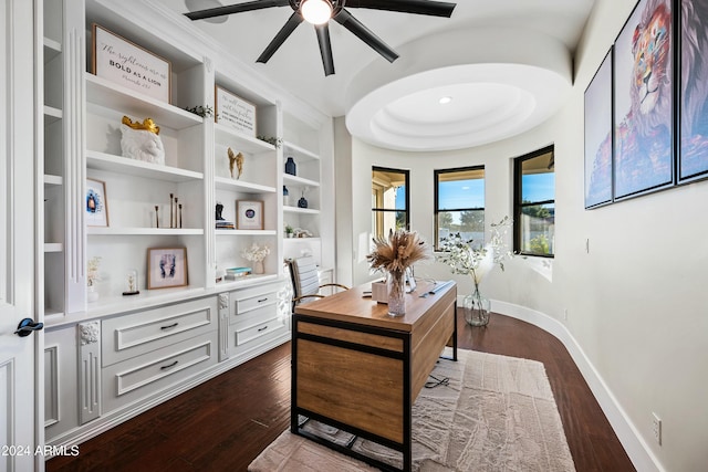 office space with ceiling fan, built in features, and dark hardwood / wood-style floors