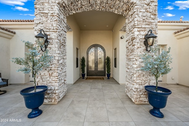 2335 E Plum St, Gilbert, AZ 85298 - property entrance with stucco siding, stone siding, and french doors