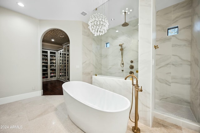 bathroom featuring independent shower and bath