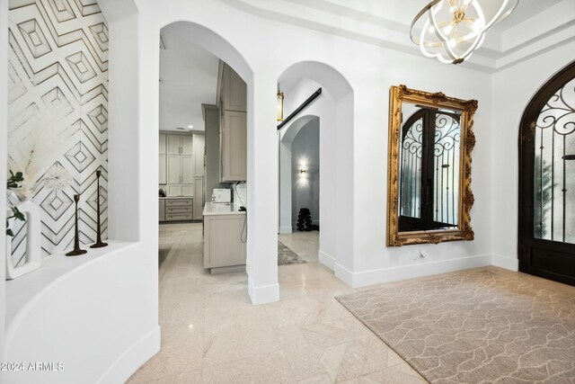 entryway with an inviting chandelier