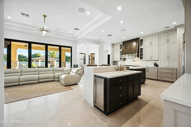2335 E Plum St, Gilbert, AZ 85298 - kitchen featuring custom range hood, ceiling fan, a kitchen island with sink, recessed lighting, and light countertops