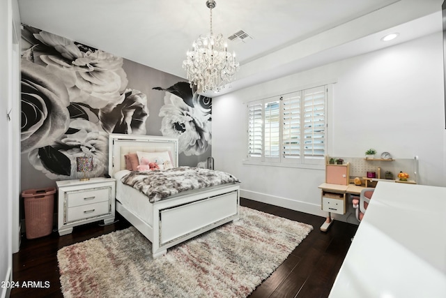 bedroom featuring a chandelier and dark wood-type flooring