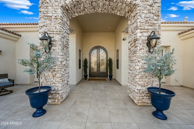 property entrance featuring french doors