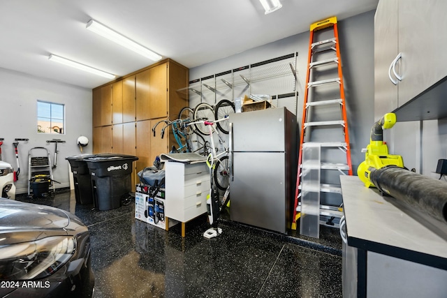 garage featuring stainless steel fridge