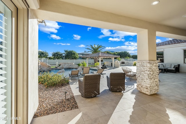 view of patio / terrace featuring outdoor lounge area and a gazebo