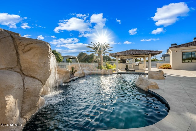 view of swimming pool with a gazebo, pool water feature, and a patio