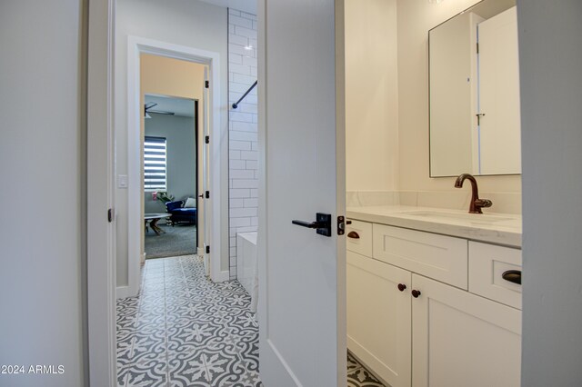 bathroom with vanity and  shower combination