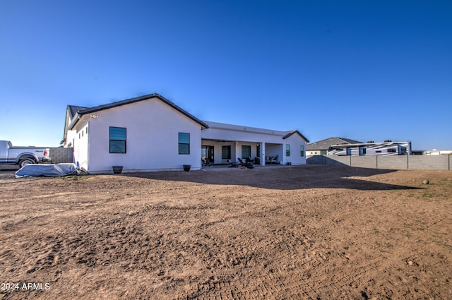 back of property featuring a patio area