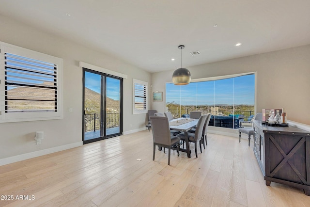 dining room with recessed lighting, visible vents, light wood-style flooring, and baseboards