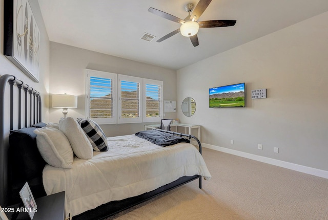 bedroom featuring carpet floors, a ceiling fan, visible vents, and baseboards