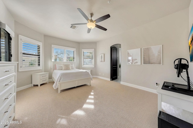 bedroom with light carpet, baseboards, and visible vents