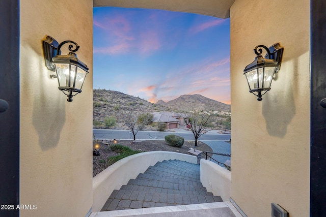 patio terrace at dusk with a mountain view