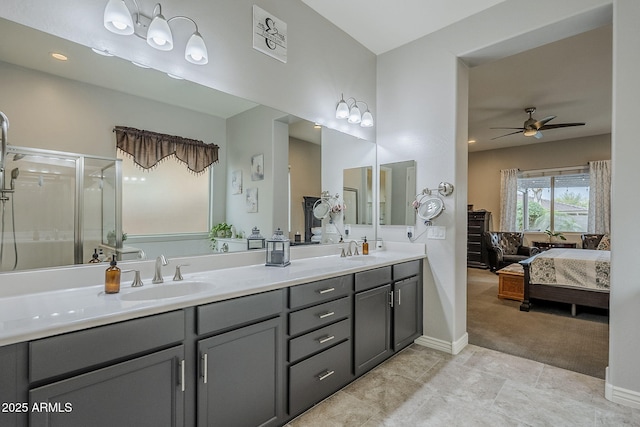 2525 W Balao Dr, Phoenix, AZ 85085 - full bathroom with a ceiling fan, ensuite bath, double vanity, baseboards, and a shower stall