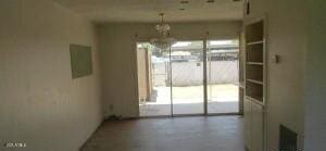 6029 N 31st Ave, Phoenix, AZ 85017 - unfurnished dining area with a chandelier and electric panel