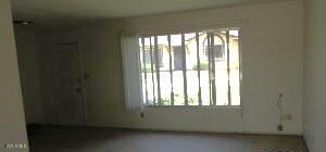 6029 N 31st Ave, Phoenix, AZ 85017 - spare room with healthy amount of natural light