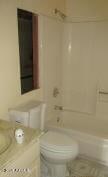 6029 N 31st Ave, Phoenix, AZ 85017 - full bath with toilet,  shower combination, and vanity