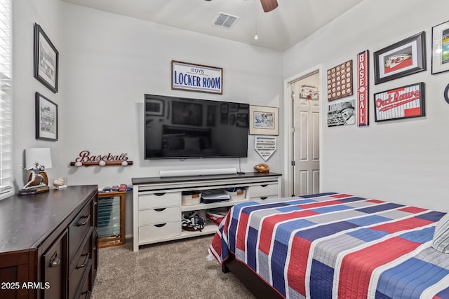 bedroom featuring ceiling fan and dark colored carpet