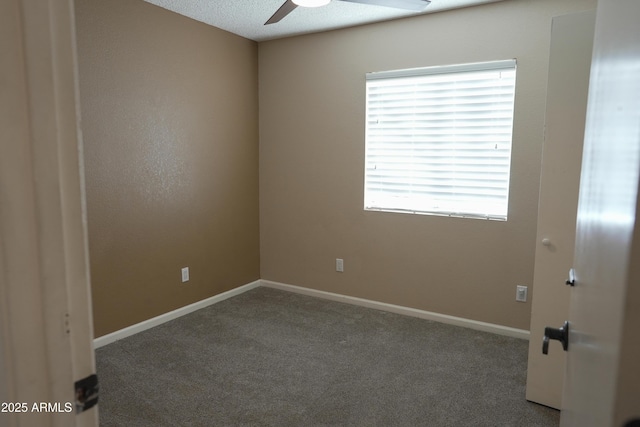 carpeted empty room featuring a textured ceiling and ceiling fan