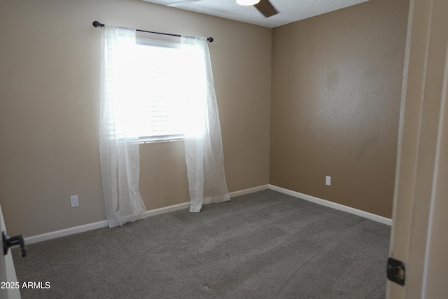 empty room with a textured ceiling, carpet floors, and ceiling fan