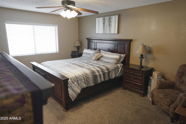 bedroom featuring light carpet, a textured ceiling, and ceiling fan