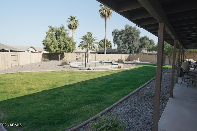 view of yard with a fenced in pool and a patio