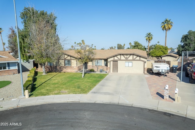 view of front of home featuring a garage and a front lawn