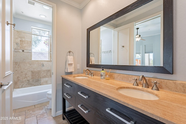 bathroom with a sink, toilet, and crown molding