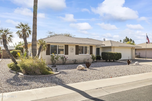 ranch-style home featuring a garage