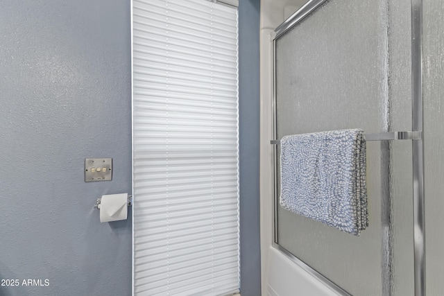 bathroom featuring enclosed tub / shower combo