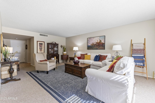 carpeted living room featuring a textured ceiling