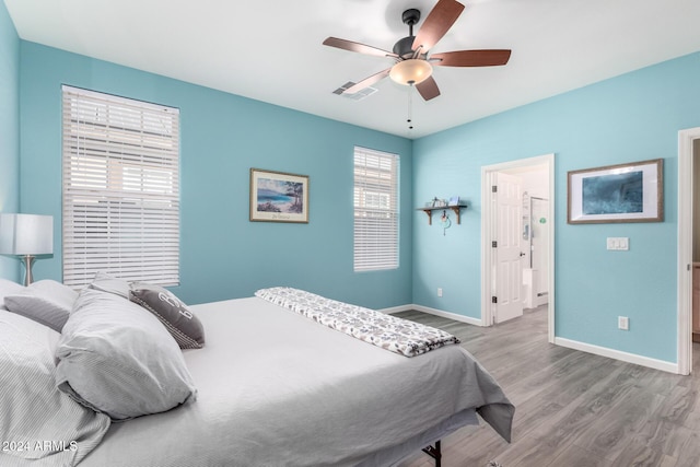 bedroom with light wood-type flooring and ceiling fan