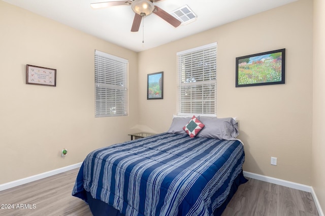 bedroom featuring ceiling fan and wood-type flooring