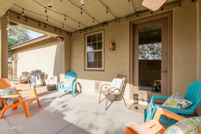 view of patio featuring a grill