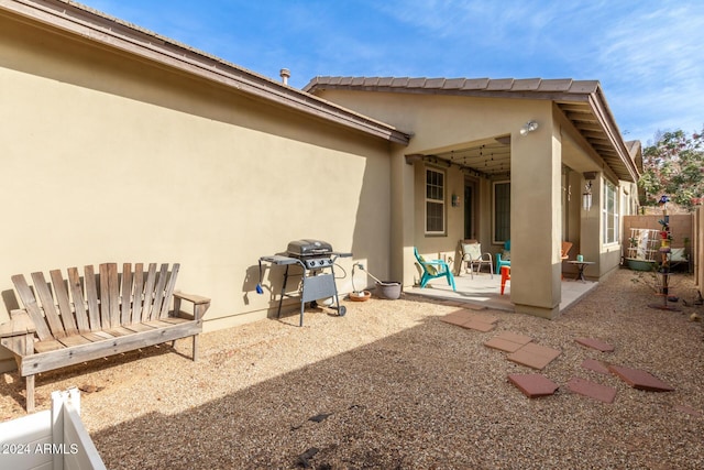 back of house with a patio