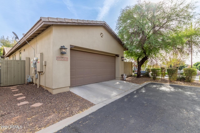 view of side of home with a garage