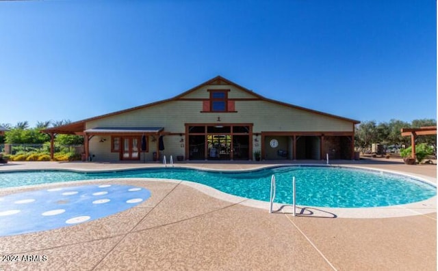 view of pool featuring a patio area