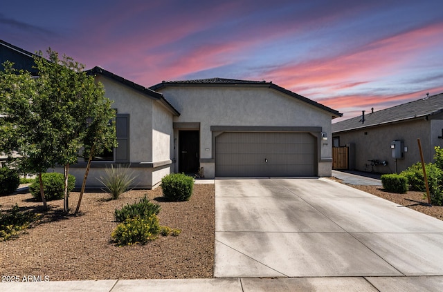16617 W Desert Mirage Dr, Surprise, AZ 85388 - ranch-style house with an attached garage, driveway, and stucco siding