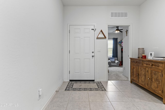 16617 W Desert Mirage Dr, Surprise, AZ 85388 - foyer entrance featuring a ceiling fan, light tile patterned floors, and baseboards