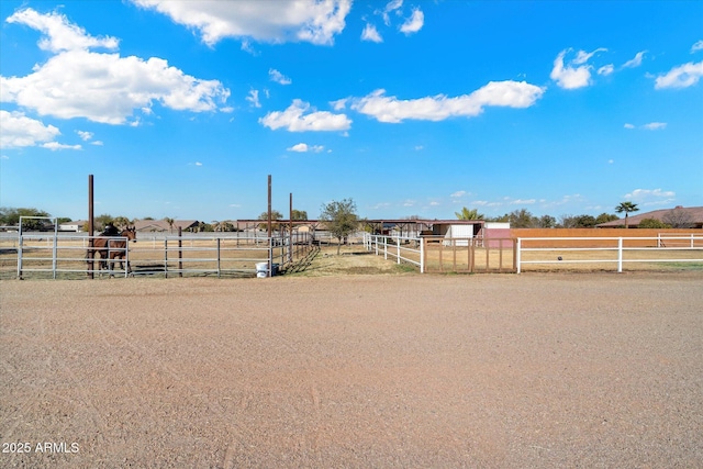 view of yard with a rural view