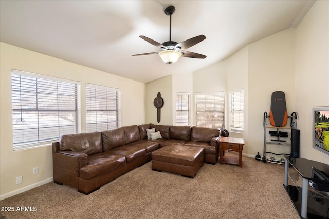 carpeted living room with ceiling fan, plenty of natural light, and lofted ceiling