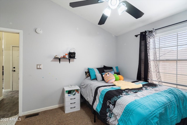 carpeted bedroom with vaulted ceiling and ceiling fan