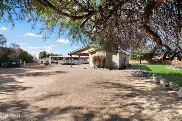 view of side of property featuring an outbuilding