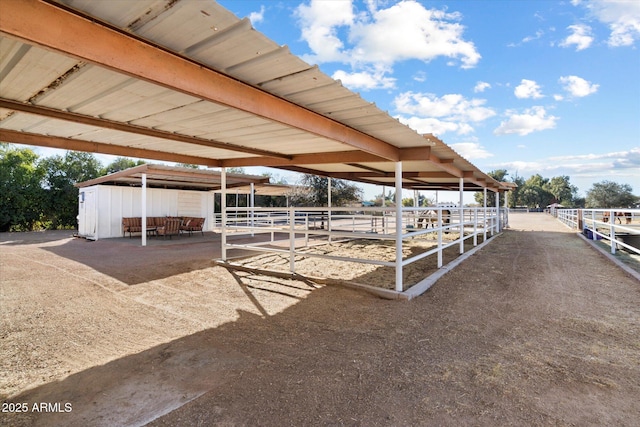 view of stable with a rural view