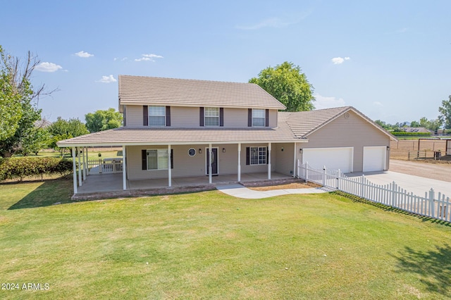 farmhouse inspired home with a garage, a front yard, and covered porch