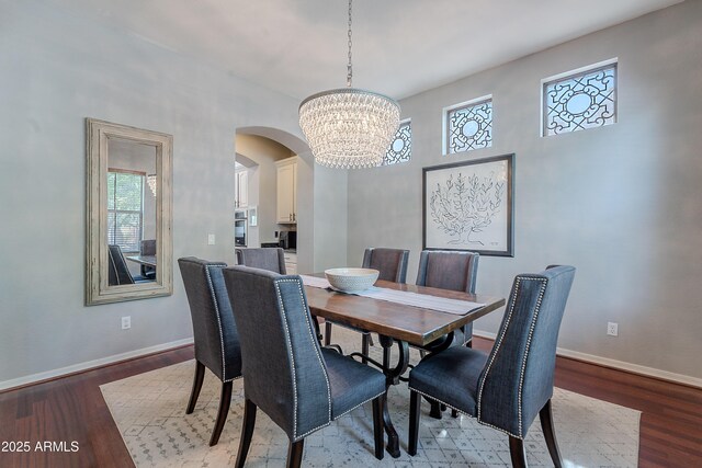 2735 E Flower Ct, Gilbert, AZ 85298 - dining room featuring arched walkways, a chandelier, baseboards, and plenty of natural light