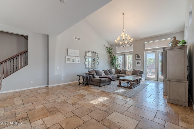 2735 E Flower Ct, Gilbert, AZ 85298 - living room featuring stone tile flooring, high vaulted ceiling, a chandelier, and baseboards