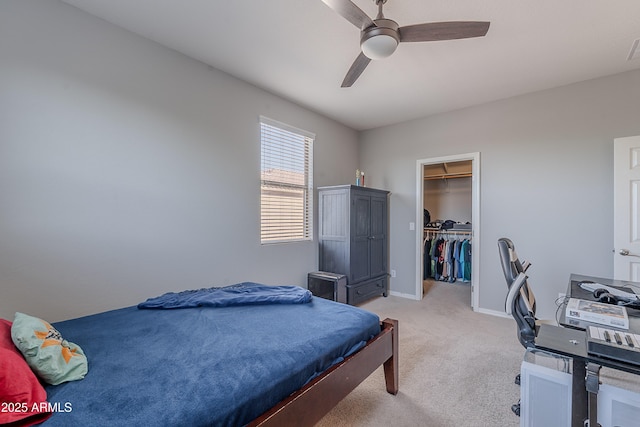 2735 E Flower Ct, Gilbert, AZ 85298 - bedroom with light colored carpet, a walk in closet, ceiling fan, baseboards, and a closet