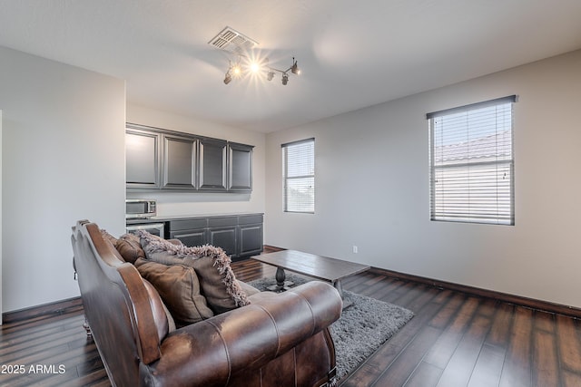 2735 E Flower Ct, Gilbert, AZ 85298 - living area featuring dark wood-style flooring and baseboards