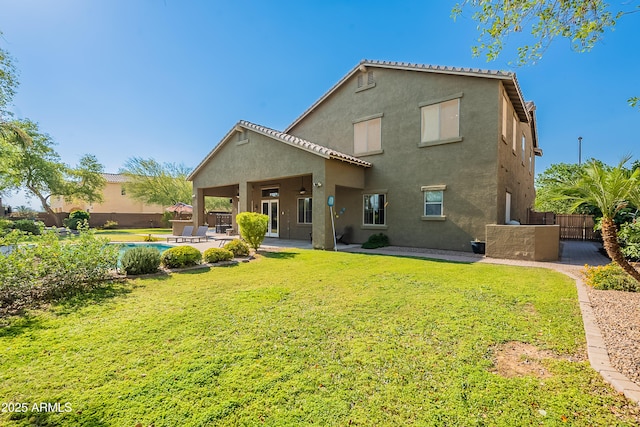 2735 E Flower Ct, Gilbert, AZ 85298 - back of property with stucco siding, a patio, and a gate