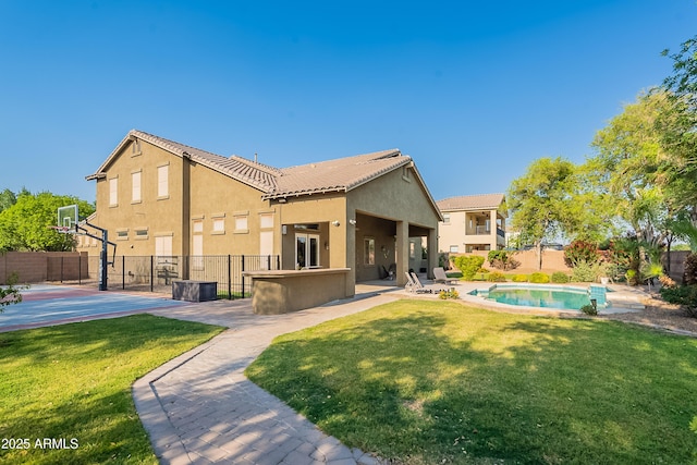 2735 E Flower Ct, Gilbert, AZ 85298 - back of property with stucco siding, basketball court, and a tiled roof